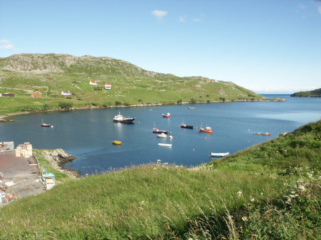Boats moored in the natural harbour at Lemreway