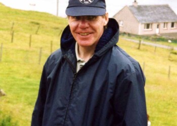 A man in a baseball cap