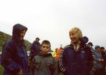People standing outside in wet weather