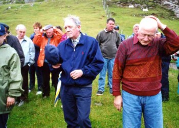A group standing at the bottom of a hill