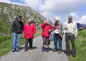 Regular visitors join the Comunn Eachdraidh walk through Calbost in 2006 5 people walking down hill