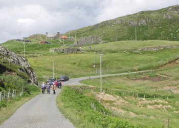 Walking through the village at the start of the walk Walking up a hill