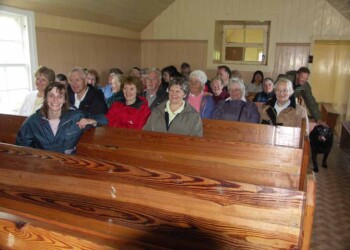 The service in the meetiing house at Calbost Group seated on pews