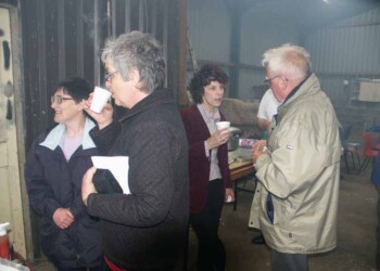 Barbecue in Murdo\'s shed People standing in door of smokey shed