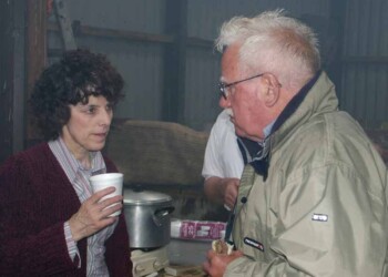 Donald and Nellie Angie looking serious Man and woman talking and drinking tea