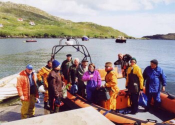 Group on boat leaving for the Shiants Group getting onto boat