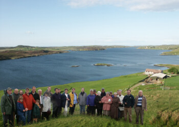 Group photo in Harbost 2003 Group standing on grassy hill with loch in background