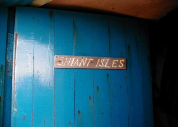 Shiants house door Blue door with hand made sign "Shiant Isles"