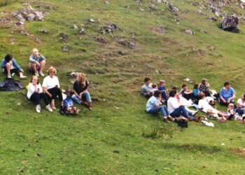 Relaxing on the hillside at Stiomreway Group sitting on a grassy hill