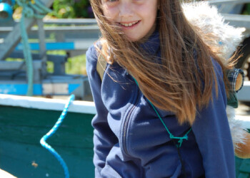 Enjoying Eiskein A girl sitting on a wall