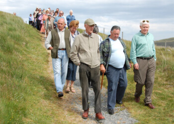 Group Leaving the Cairn Group walking down a track