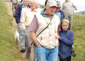 Group Leaving the Pairc Cairn Group walking down a track