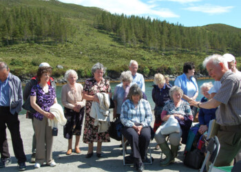 John addresses the group at Eiskein Man addressing a group of people