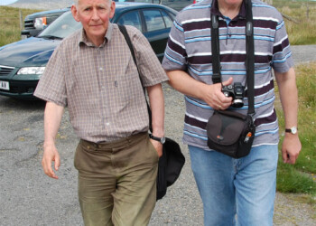 John and Coinneach Mor anxious to get to Eiskein 2 men walking away from cars