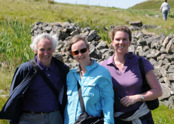 3 people smiling in the sunshine