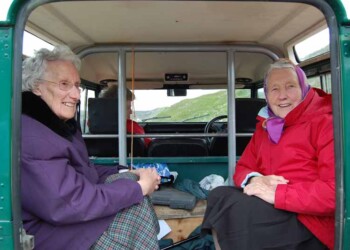 2 women in the back of a landrover