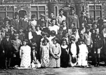Close-up of Kershader School Group in front of Stornoway Town Hall on the occasion of the Coronation in 1937 Close-up of Kershader School Group in front of Stornoway Town Hall on the occasion of the Coronation in 1937